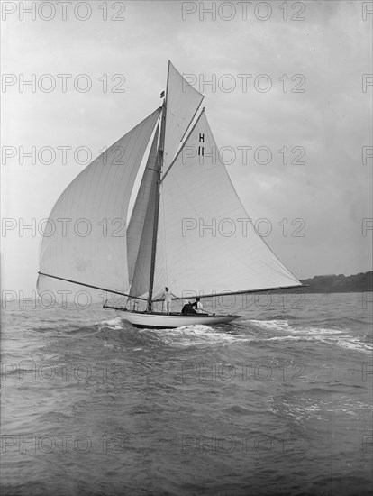 'Ventana' (H11), an early 8 Metre yacht, running downwind under spinnaker, 1913. Creator: Kirk & Sons of Cowes.