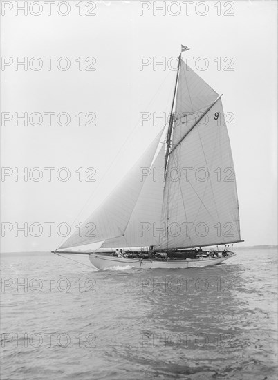 The cutter 'Westwind' sailing close-hauled, 1912. Creator: Kirk & Sons of Cowes.