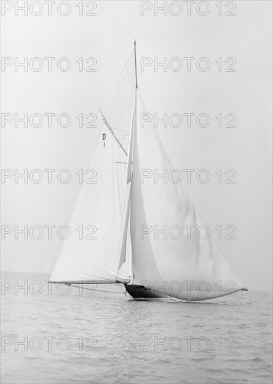 The 15 Metre sailing yacht 'Pamela' searching for wind, 1913. Creator: Kirk & Sons of Cowes.