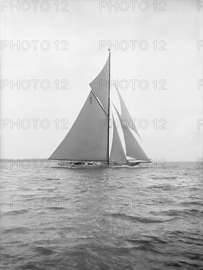 The 15 Metre 'Istria' sailing close-hauled, 1913. Creator: Kirk & Sons of Cowes.