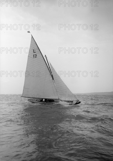 The 6 Metre 'Ejnar' breaking waves, 1912. Creator: Kirk & Sons of Cowes.