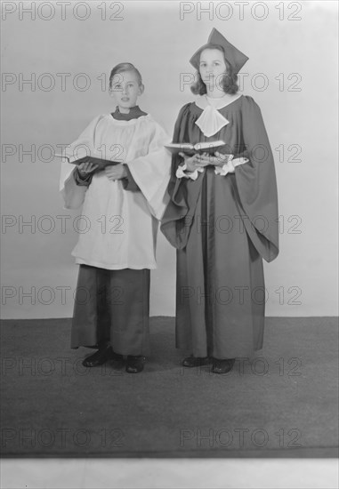 Girl and boy chorister, (Isle of Wight?), c1935. Creator: Kirk & Sons of Cowes.