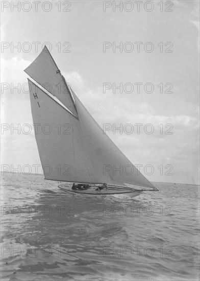 The 8 Metre yacht 'Norman' (H1) sailing close-hauled, 1911. Creator: Kirk & Sons of Cowes.
