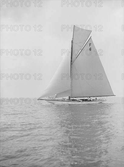 The 10 Metre class 'Eleda' (F6) sailing close-hauled, 1913. Creator: Kirk & Sons of Cowes.