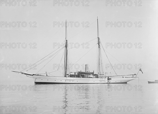 The steam yacht 'Priscilla' at anchor, 1911. Creator: Kirk & Sons of Cowes.