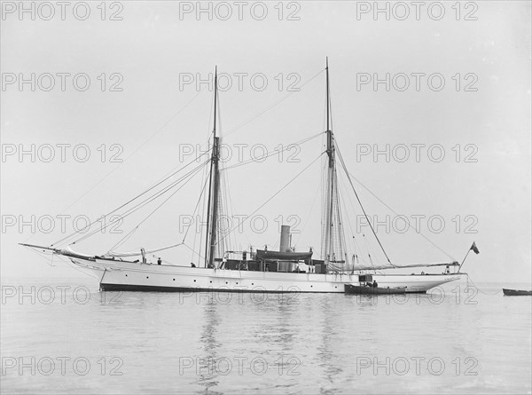 The steam yacht 'Priscilla' at anchor, 1911. Creator: Kirk & Sons of Cowes.