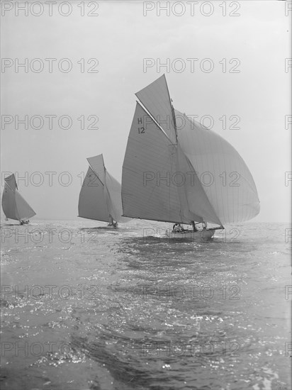 'The Truant' and 'Antwerpia IV' racing with spinnakers, 27th May 1912. Creator: Kirk & Sons of Cowes.