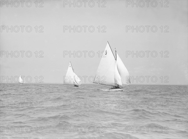 The 6 Metre 'The Whim' (L6) and 'Correnzia' racing downwind, 1911. Creator: Kirk & Sons of Cowes.