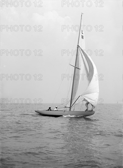 'Peterkin' running downwind with spinnaker, 1914. Creator: Kirk & Sons of Cowes.