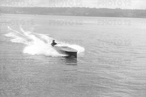 Power boat under way, 1914. Creator: Kirk & Sons of Cowes.