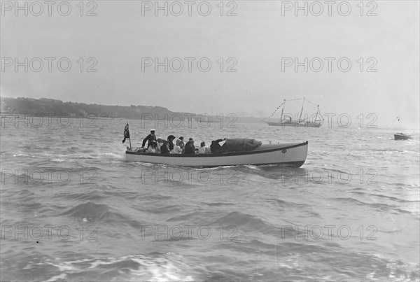 Modwena's motor launch with Modwena in the background, 1911. Creator: Kirk & Sons of Cowes.