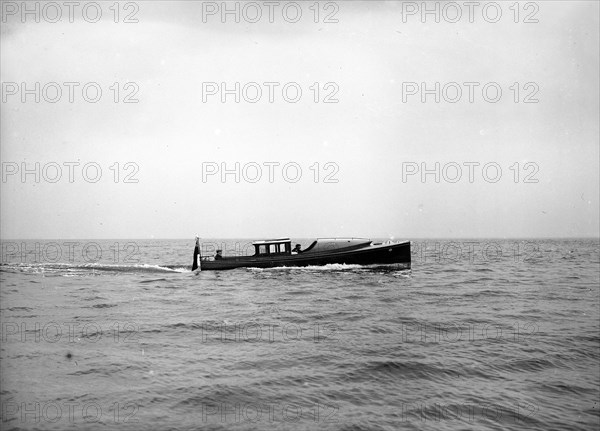 Wolseley motor launch under way, 1913. Creator: Kirk & Sons of Cowes.