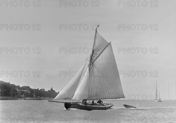 The 9 ton auxilary cutter 'Grayling', 1921. Creator: Kirk & Sons of Cowes.