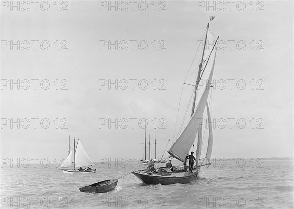 The 9 ton auxilary cutter 'Grayling' with tender, 1921. Creator: Kirk & Sons of Cowes.