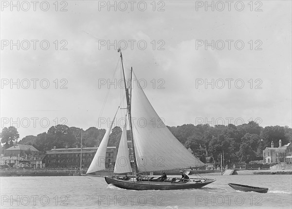 The 9 ton auxilary cutter 'Grayling' with  tender, 1921. Creator: Kirk & Sons of Cowes.