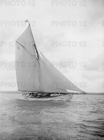 The cutter 'Westwind' sailing close-hauled, 1912. Creator: Kirk & Sons of Cowes.