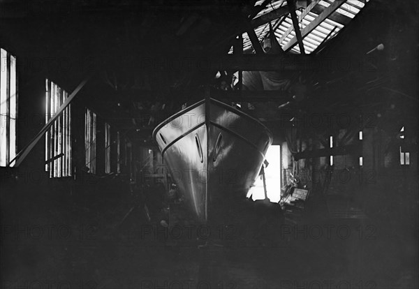 Egyptian motor launch in shed, 1911. Creator: Kirk & Sons of Cowes.