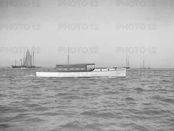 The motor launch 'Cygnet' under way, 1912. Creator: Kirk & Sons of Cowes.