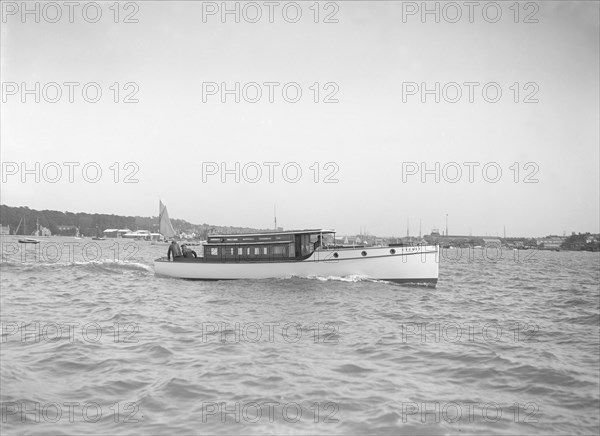 The motor launch 'Cygnet' under way, 1912. Creator: Kirk & Sons of Cowes.