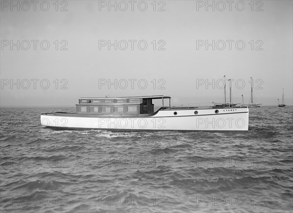 The motor launch 'Cygnet' under way, 1912. Creator: Kirk & Sons of Cowes.