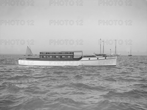The motor launch 'Cygnet' under way, 1912. Creator: Kirk & Sons of Cowes.