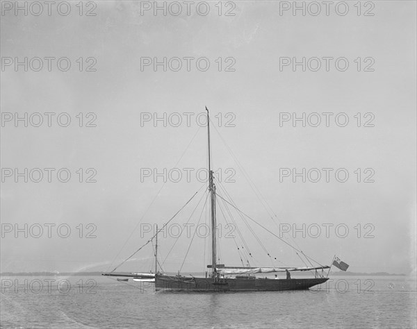 The cutter 'Cymberline' under way by motor. Creator: Kirk & Sons of Cowes.