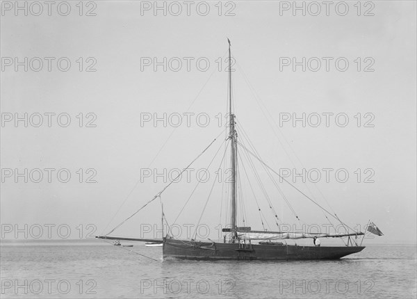 The cutter 'Cymberline' under way by motor. Creator: Kirk & Sons of Cowes.