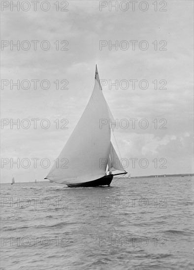 The yawl 'Harbinger' running downwind, 1922. Creator: Kirk & Sons of Cowes.