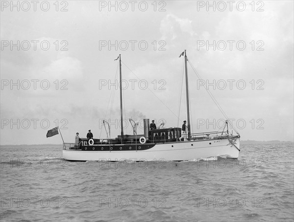 The 23 ton motor yacht 'Kiwi' under way, 1914. Creator: Kirk & Sons of Cowes.