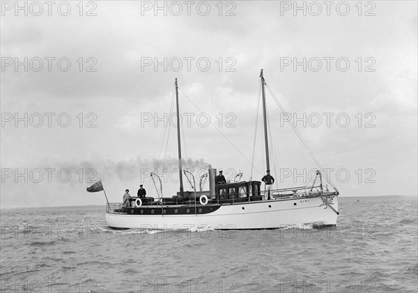 The 23 ton motor yacht 'Kiwi' under way, 1914. Creator: Kirk & Sons of Cowes.