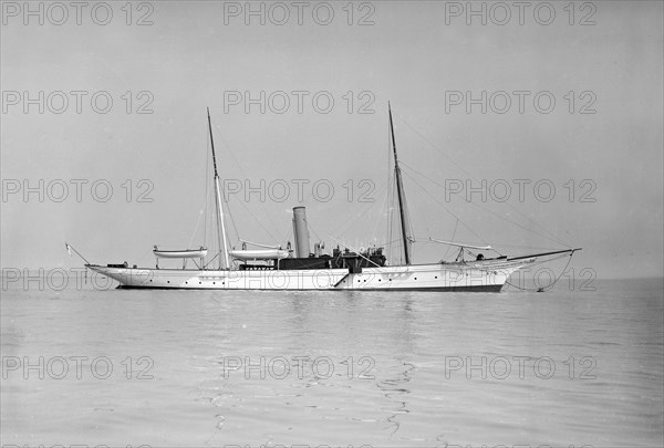 The 70 ton steam yacht 'Ombra' at anchor, 1911. Creator: Kirk & Sons of Cowes.