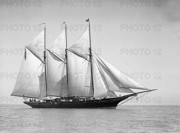 The three-mast auxiliary schooner 'Invincible', 1911. Creator: Kirk & Sons of Cowes.