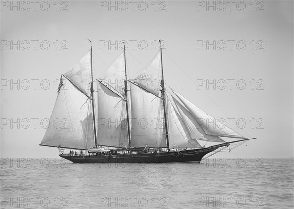 The three-mast auxiliary schooner 'Invincible', 1911. Creator: Kirk & Sons of Cowes.