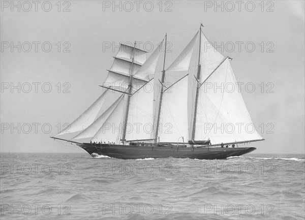 The auxiliary schooner 'La Cigale' sailing close-hauled, 1913. Creator: Kirk & Sons of Cowes.