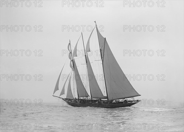 The auxiliary schooner 'La Cigale' sailing close-hauled, 1913. Creator: Kirk & Sons of Cowes.