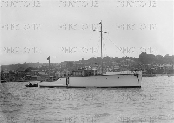 The 12 ton motor yacht 'Cordon Rouge' at anchor, 1923. Creator: Kirk & Sons of Cowes.