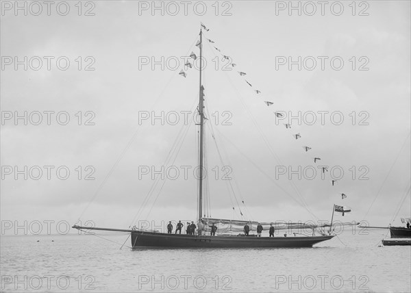 'Bloodhound' at anchor with flags, 1912. Creator: Kirk & Sons of Cowes.