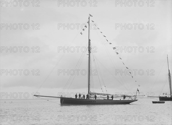 'Bloodhound' at anchor with flags, August 1912. Creator: Kirk & Sons of Cowes.