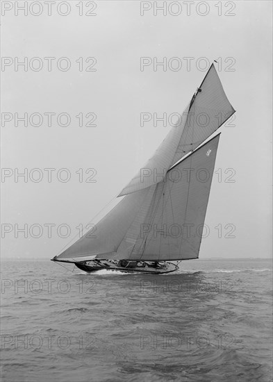 The beautiful 52 ft cutter 'Sonya' sailing close-hauled, 1913. Creator: Kirk & Sons of Cowes.