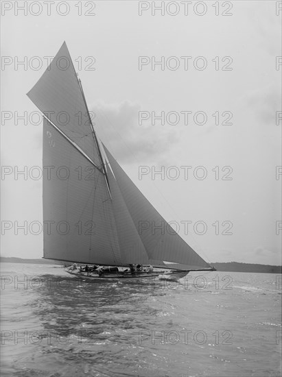 'The Lady Anne' 15 Metre class cutter sails upwind, 1912. Creator: Kirk & Sons of Cowes.