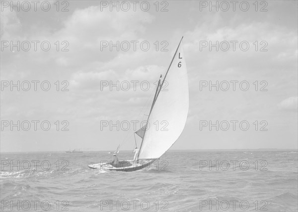 The 6 Metre class 'The Whim' (L6) sailing downwind, 1911. Creator: Kirk & Sons of Cowes.