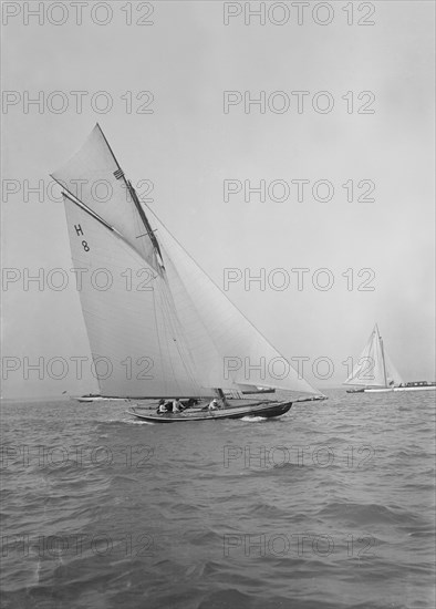 Mrs GA Shenley at the helm of the 8 Metre class 'Spero' (H8). Creator: Kirk & Sons of Cowes.