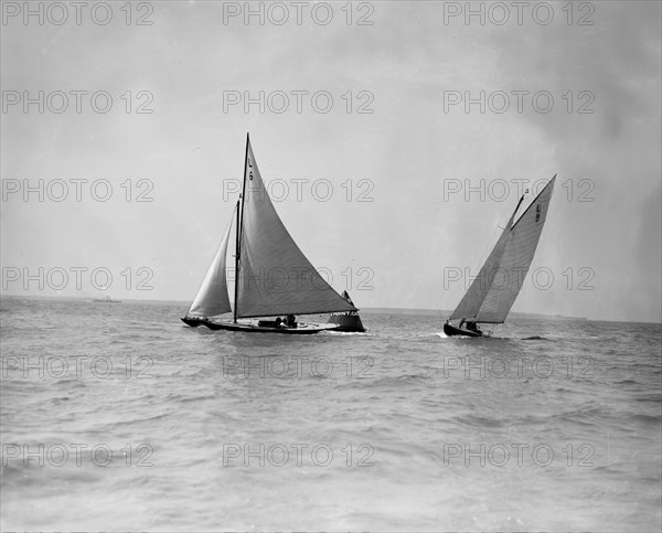 The 6 Metre yachts 'The Whim' (L6) and 'Cingalee' rounding mark, 1911. Creator: Kirk & Sons of Cowes.