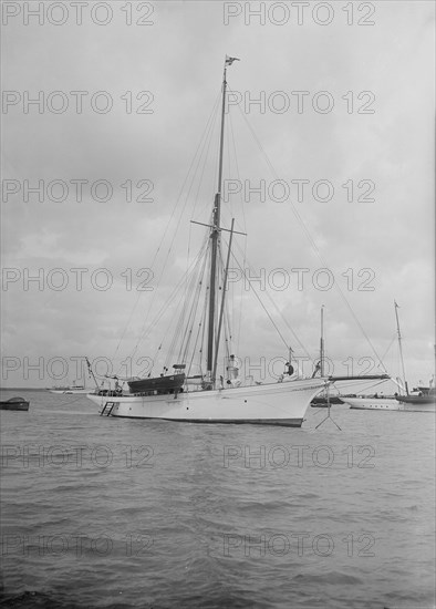 The cutter 'Yolande' at anchor, 1912. Creator: Kirk & Sons of Cowes.