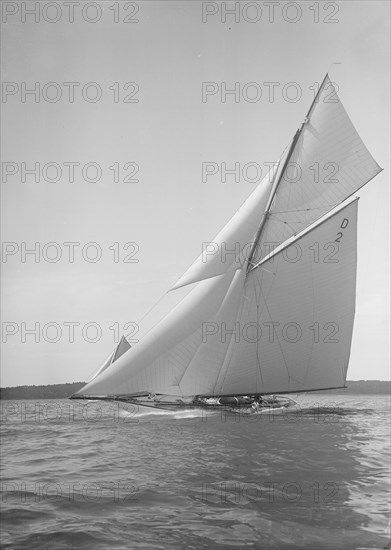 The 15 Metre cutter 'Ostara' sailing close-hauled, 1911. Creator: Kirk & Sons of Cowes.