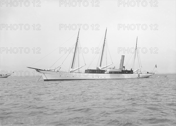 The steam yacht 'Isa' at anchor. Creator: Kirk & Sons of Cowes.