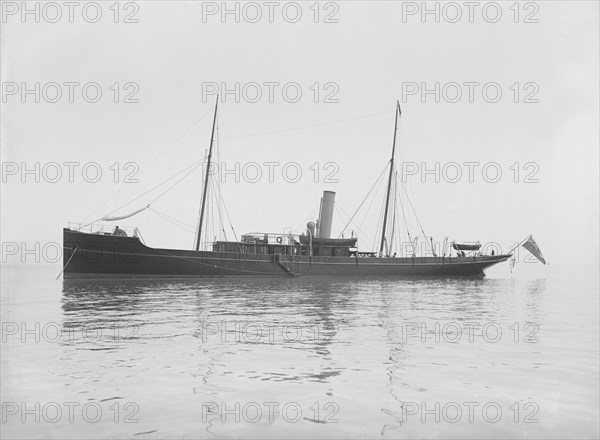 The 116 ton steam yacht 'Athena' at anchor, 1911. Creator: Kirk & Sons of Cowes.