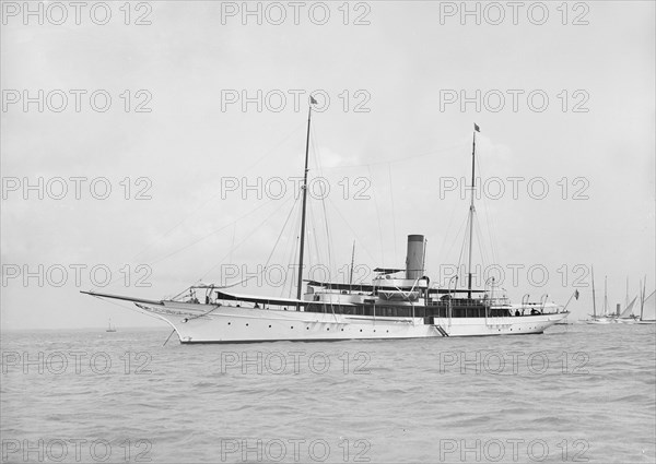 The steam yacht 'Surf' at anchor, 1912. Creator: Kirk & Sons of Cowes.