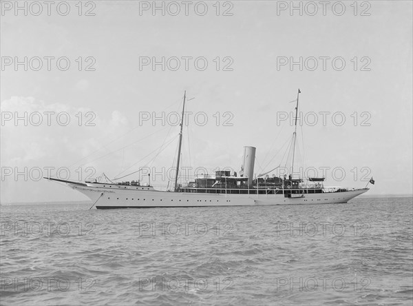 The steam yacht 'Eileen' at anchor, 1914. Creator: Kirk & Sons of Cowes.