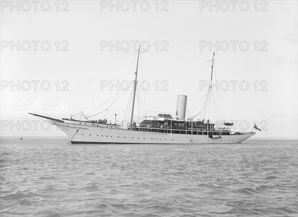 The steam yacht 'Eileen' at anchor, 1914. Creator: Kirk & Sons of Cowes.